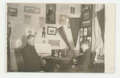 Two musicians practicing in a dorm room postcard