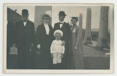 Family portrait in front of a monument postcard