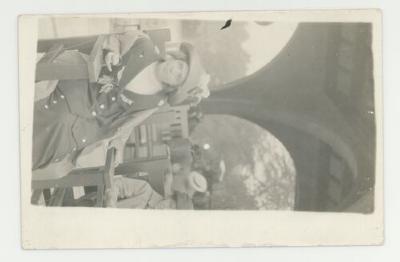 Women sitting on benches postcard