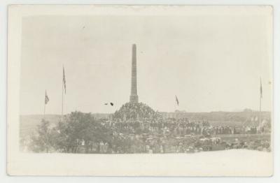 Group gathered around a monument in Norway postcard