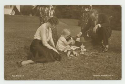 Parents playing with their daughter postcard