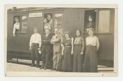 St. Olaf College choir members on a train postcard