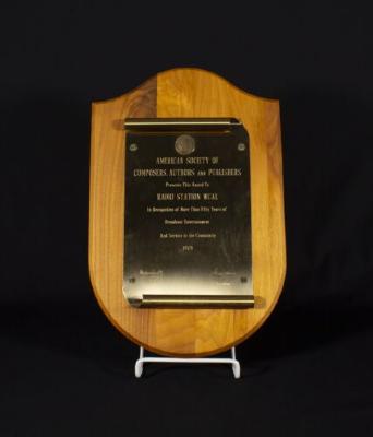 Wood and brass plaque from the American Society of Composers, Authors and Publishers "Fifty Years of Broadcast Entertainment And Service to the Community 1979"