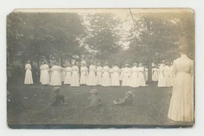 Women dressed in white postcard