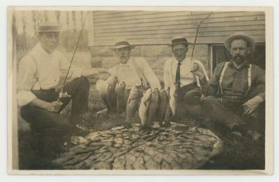 Men posing with the fish they caught postcard