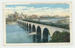 Stone Arch Bridge and milling section, Minneapolis, Minnesota postcard