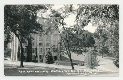 Side view of the St. Olaf College administration building through the trees postcard