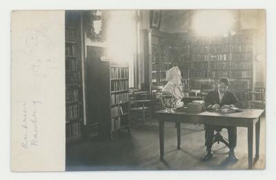 Individual studying in Steensland Library postcard