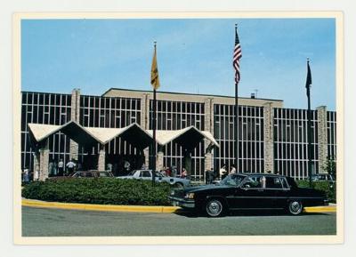 Flags flying at the entrance of the St. Olaf Center postcard